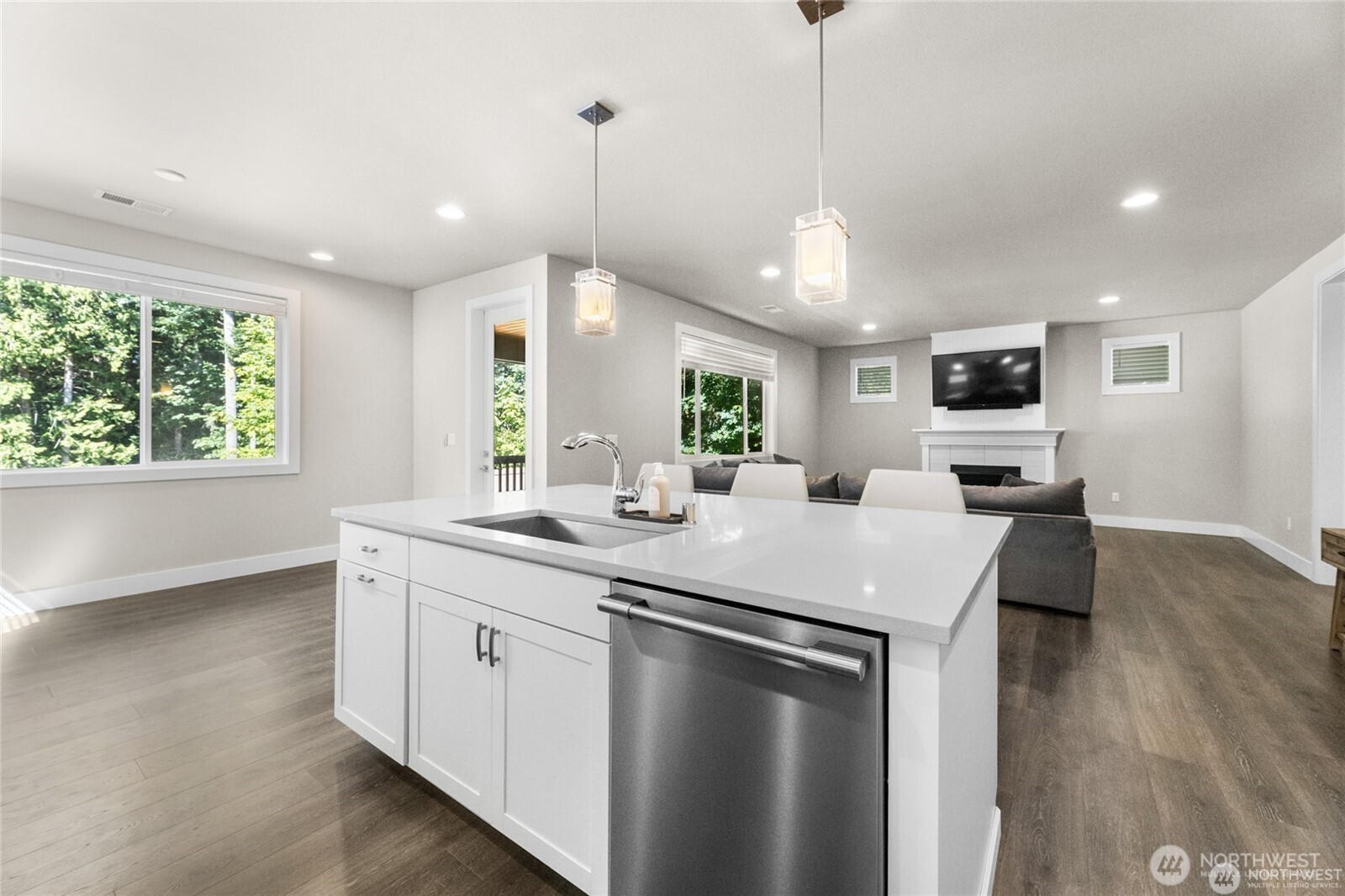 7780 53rd Place Gig Harbor, WA 98335 - Photo 12 of 39 a kitchen with center island and stainless steel appliances