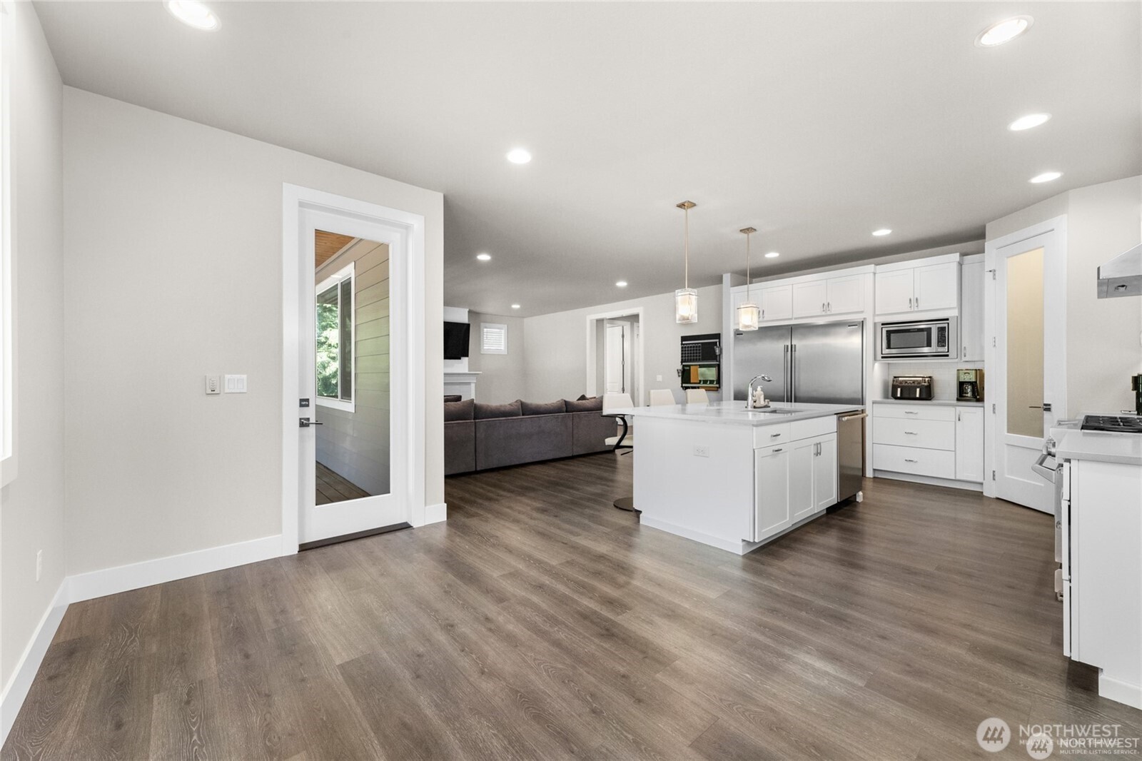 7780 53rd Place Gig Harbor, WA 98335 - Photo 13 of 39 a view of kitchen with kitchen island stainless steel appliances refrigerator stove microwave and cabinets