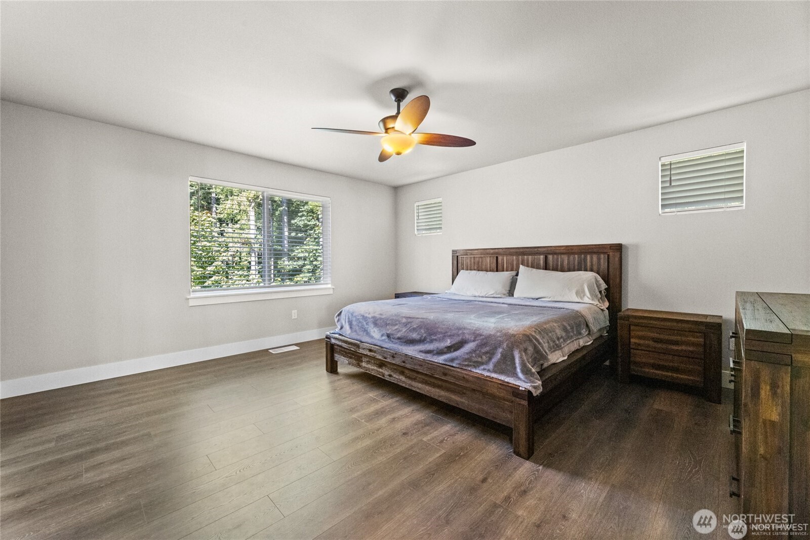 7780 53rd Place Gig Harbor, WA 98335 - Photo 15 of 39 a bedroom with a bed a window and lamps