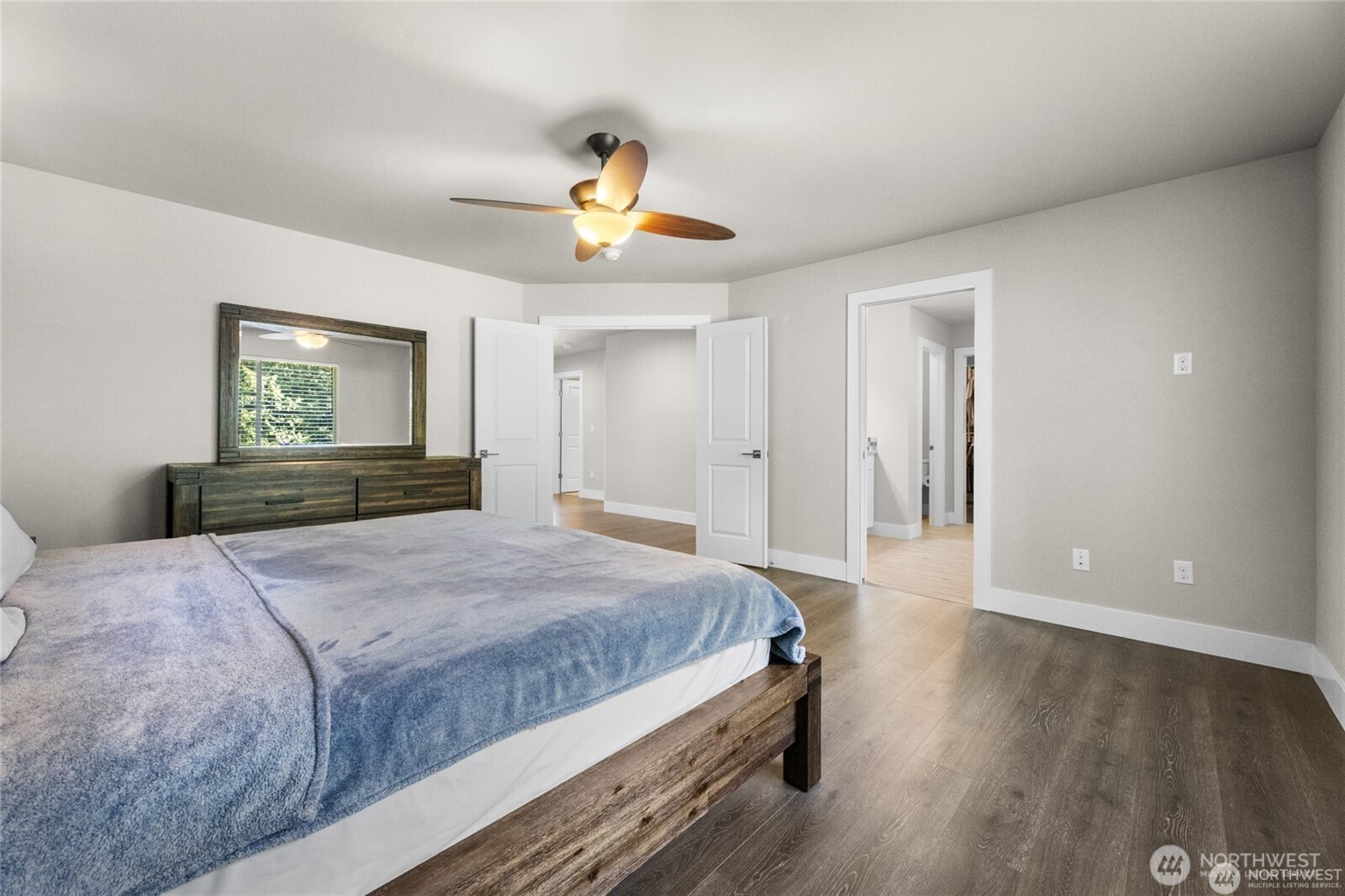 7780 53rd Place Gig Harbor, WA 98335 - Photo 16 of 39 a bedroom with a bed and a dresser