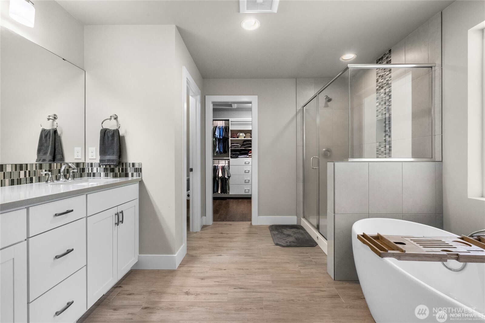 7780 53rd Place Gig Harbor, WA 98335 - Photo 17 of 39 a bathroom with a granite countertop sink a toilet and shower