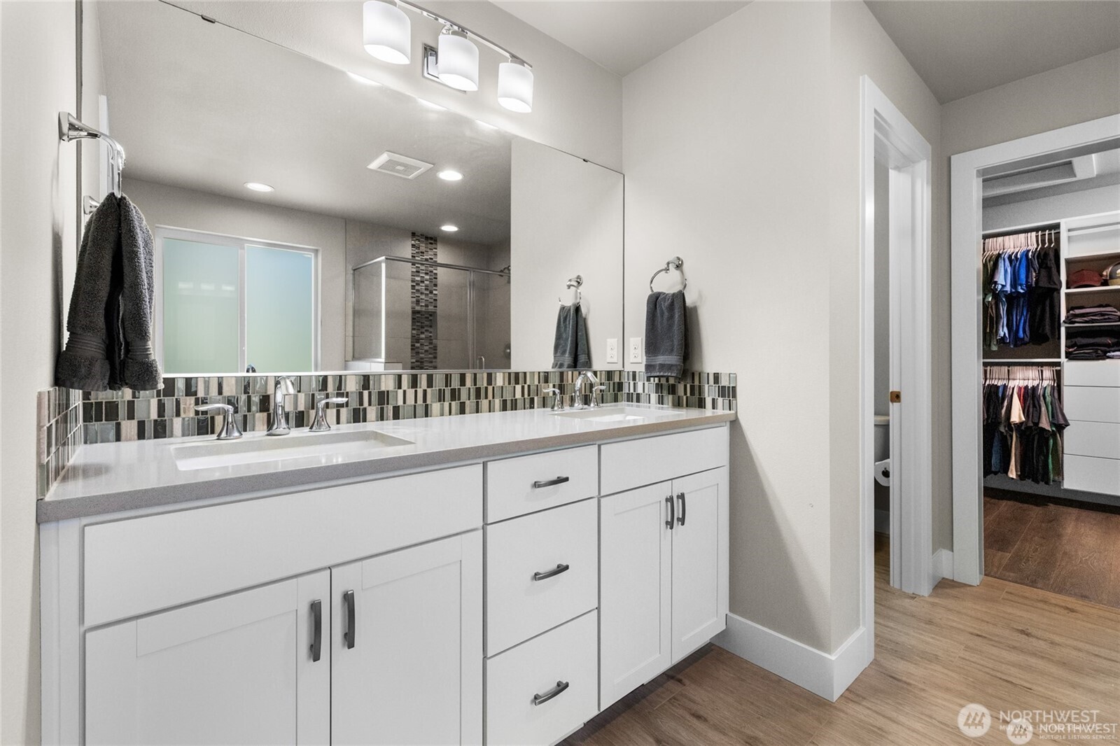 7780 53rd Place Gig Harbor, WA 98335 - Photo 18 of 39 a bathroom with a double vanity sink and a mirror