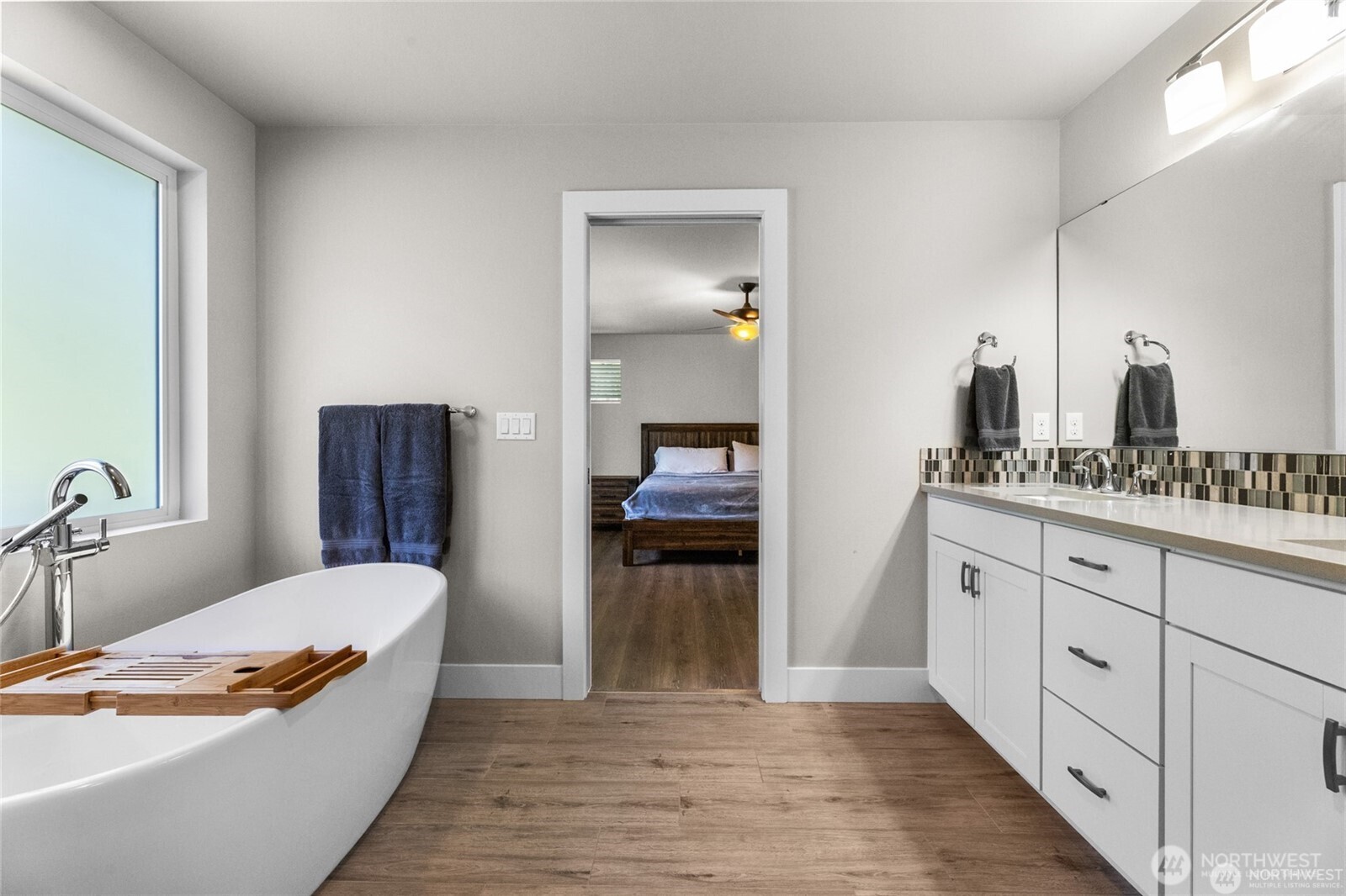 7780 53rd Place Gig Harbor, WA 98335 - Photo 20 of 39 a en suite bathroom with a granite countertop sink and a mirror