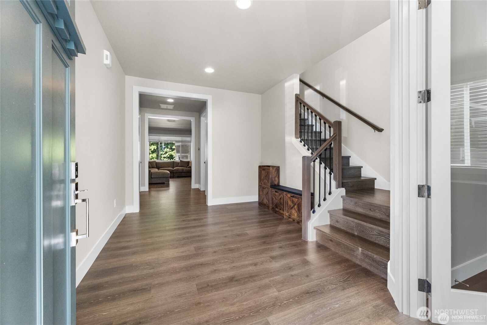 7780 53rd Place Gig Harbor, WA 98335 - Photo 2 of 39 a view of a hallway view with wooden floor and staircase