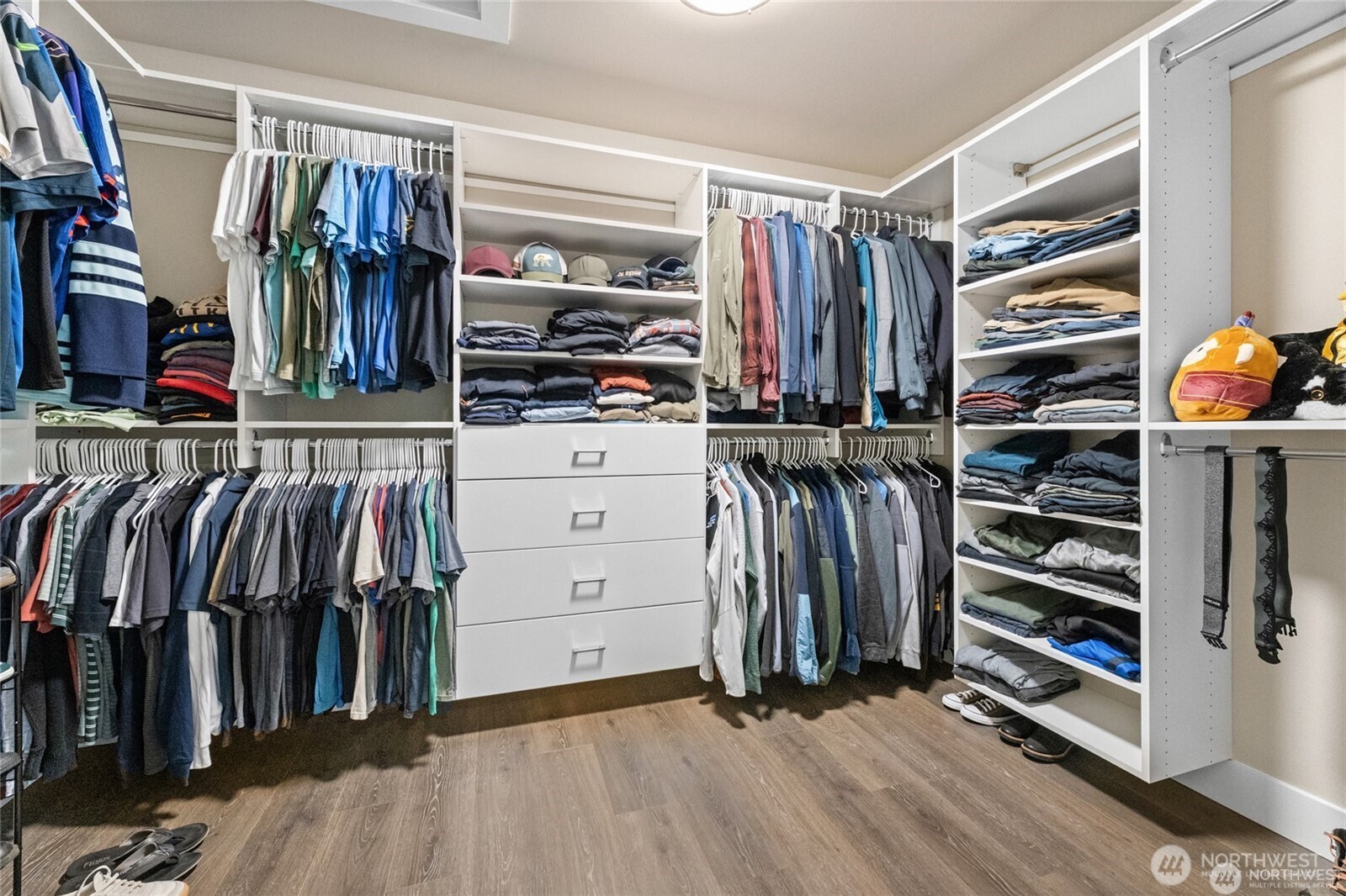 7780 53rd Place Gig Harbor, WA 98335 - Photo 21 of 39 a view of walk in closet with clothes and shoes