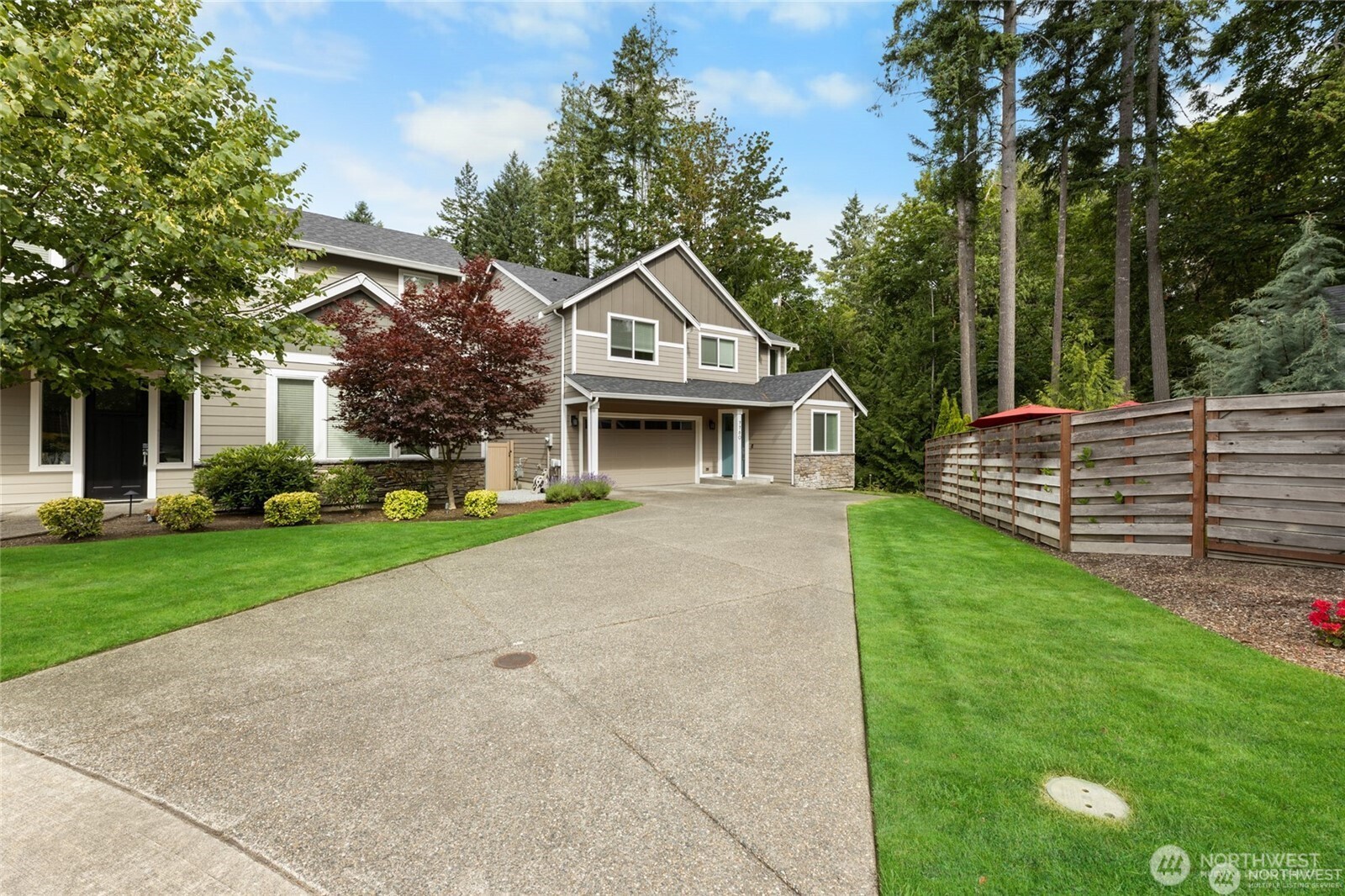 7780 53rd Place Gig Harbor, WA 98335 - Photo 29 of 39 a front view of a house with garden