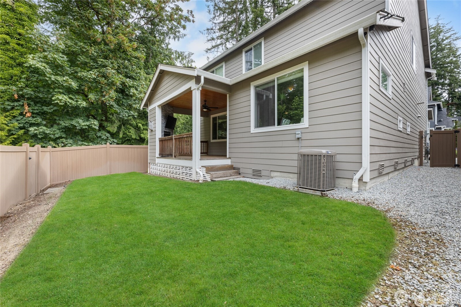 7780 53rd Place Gig Harbor, WA 98335 - Photo 31 of 39 front view of a house with a yard
