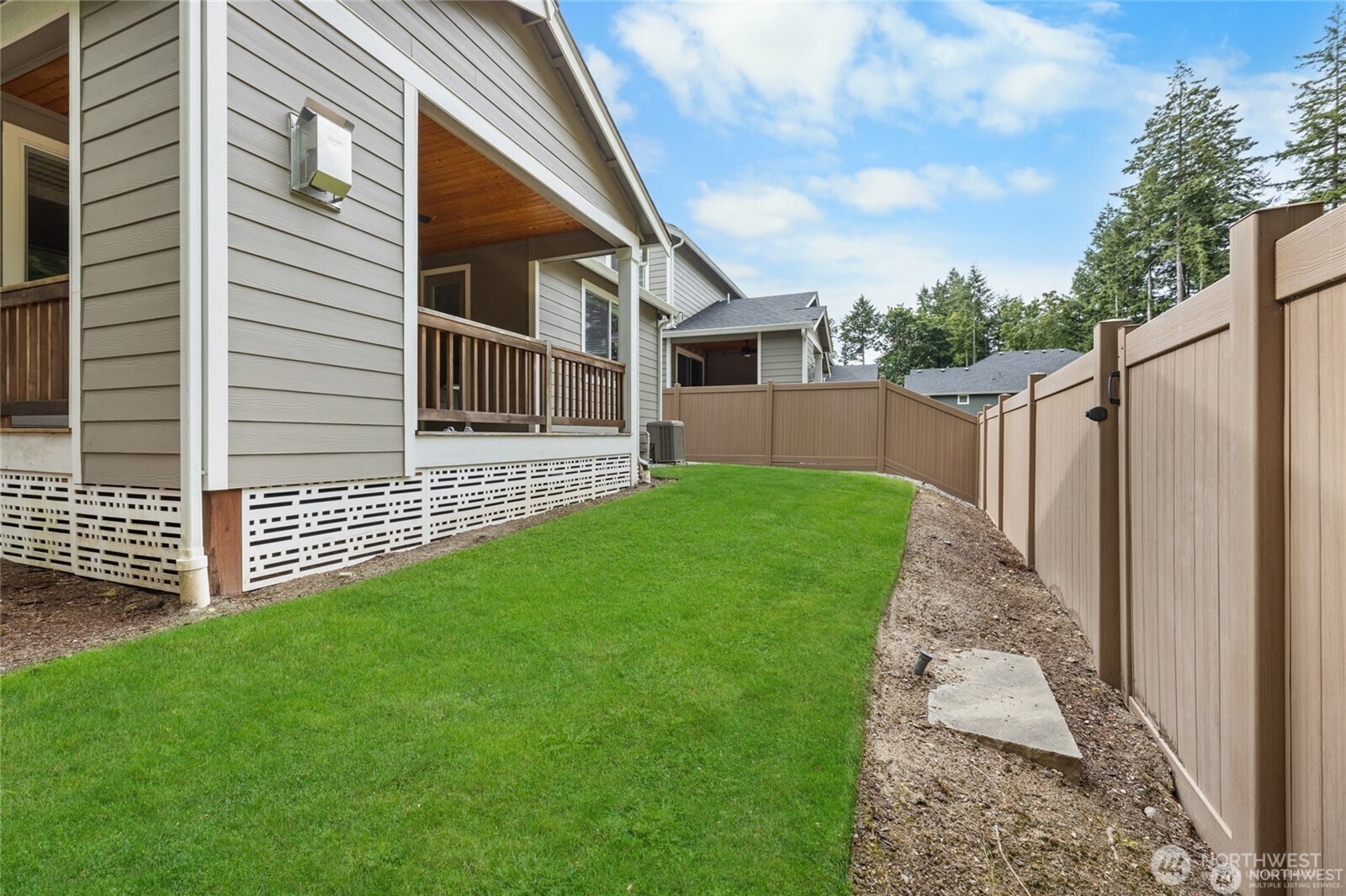 7780 53rd Place Gig Harbor, WA 98335 - Photo 32 of 39 a view of a back yard of the house