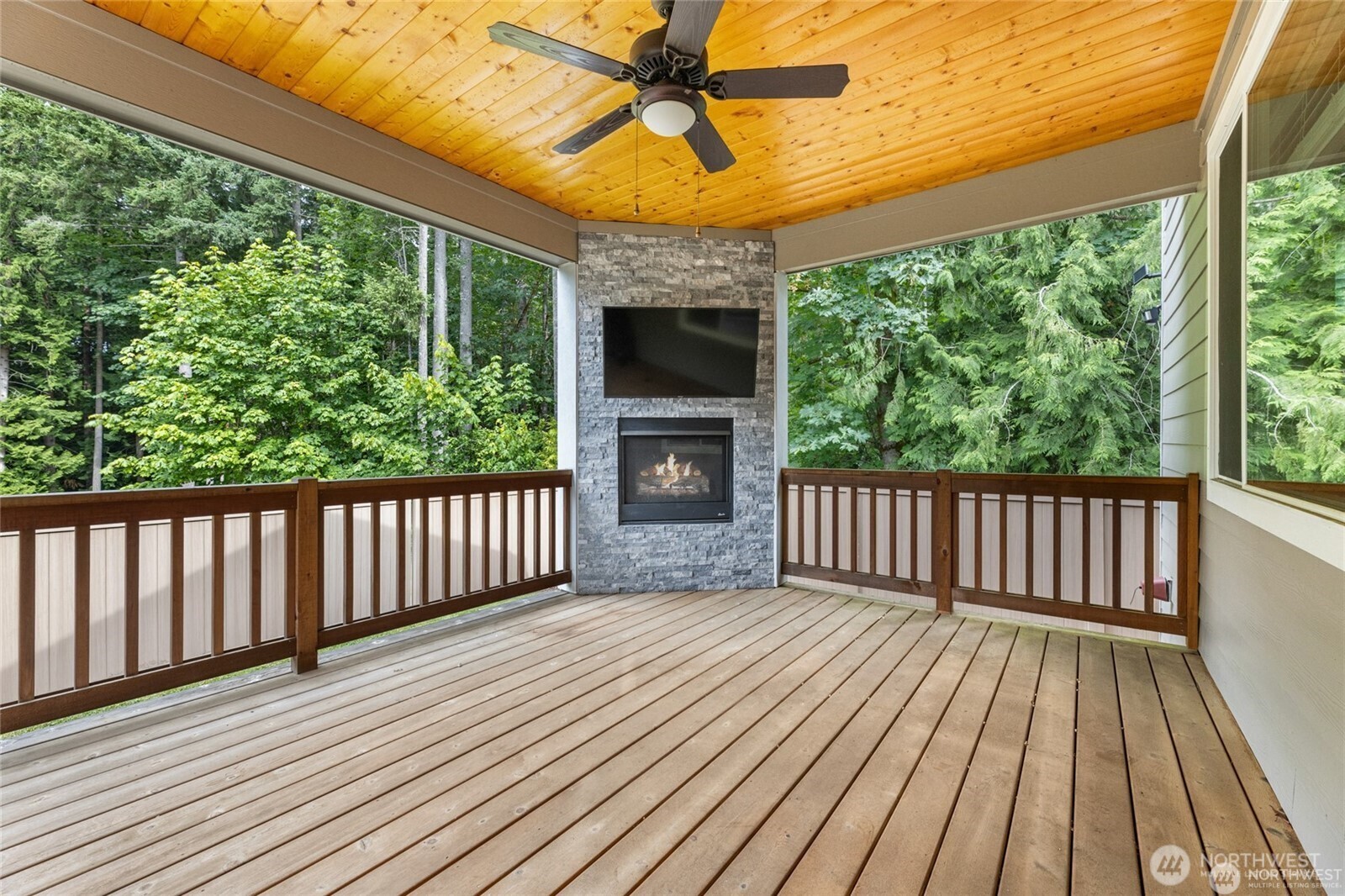 7780 53rd Place Gig Harbor, WA 98335 - Photo 33 of 39 a view of backyard with a deck and wooden floor