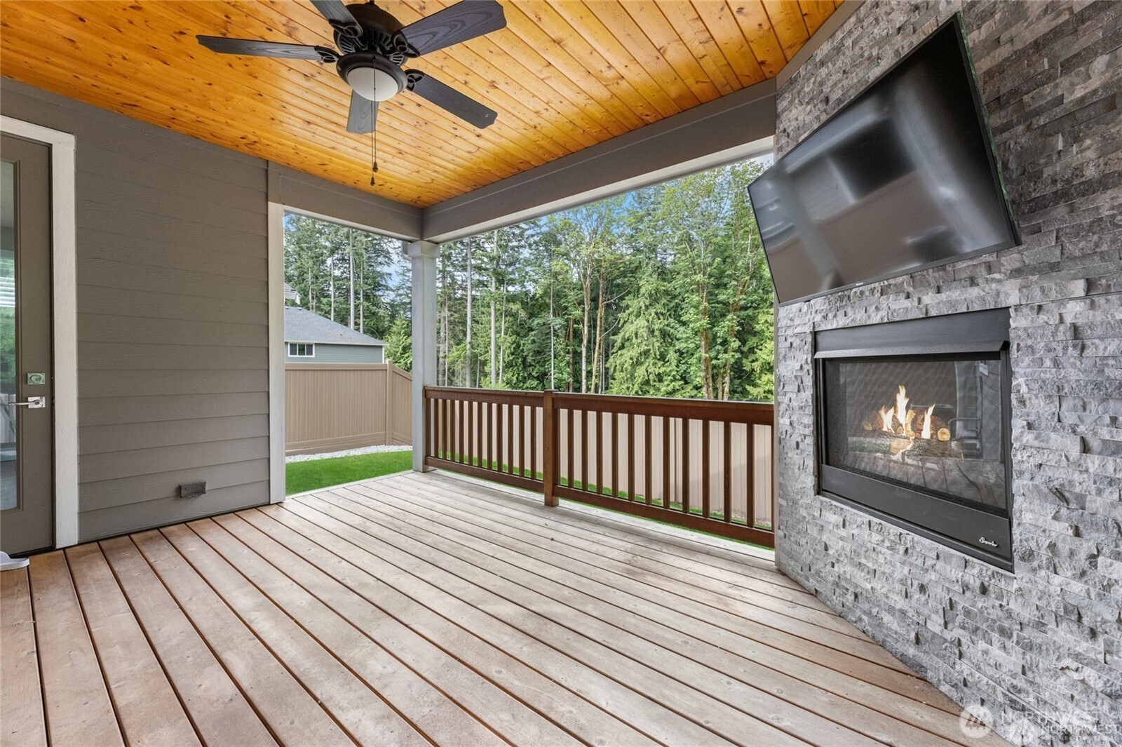 7780 53rd Place Gig Harbor, WA 98335 - Photo 34 of 39 a view of livingroom with hardwood floor and a fireplace