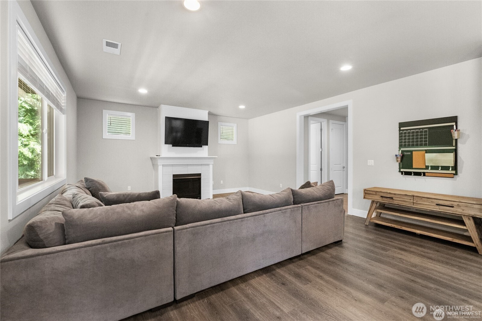 7780 53rd Place Gig Harbor, WA 98335 - Photo 7 of 39 a living room with furniture fireplace and flat screen tv