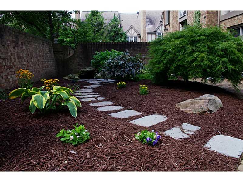407 Landon Gate Pittsburgh, PA 15215 - Photo 2 of 25 Exterior Front. Private courtyard with pond and fountain welcomes visitors to your private oasis.