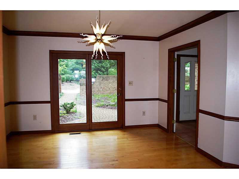 407 Landon Gate Pittsburgh, PA 15215 - Photo 13 of 25 Dining Room. Hardwood floors, sliding glass doors to the courtyard and Chihuly inspired light fixture.