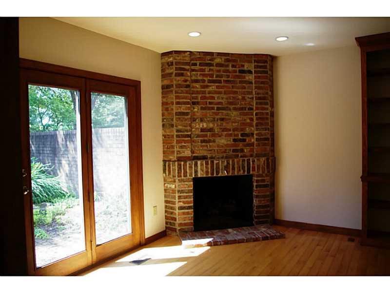407 Landon Gate Pittsburgh, PA 15215 - Photo 14 of 25 Den. 1st floor den/office features a gas burning brick fireplace and courtyard access.