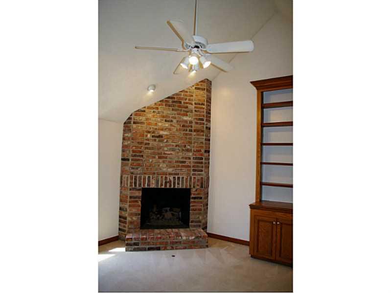 407 Landon Gate Pittsburgh, PA 15215 - Photo 15 of 25 Den. 2nd floor den/office features a gas burning brick fireplace, built-in bookcases, vaulted ceiling and fan.