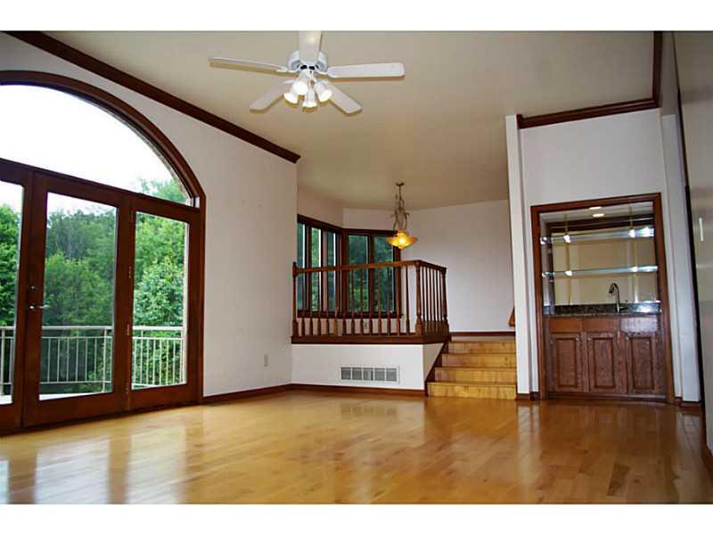 407 Landon Gate Pittsburgh, PA 15215 - Photo 5 of 25 Great Room. Amenities galore! Wet bar and French doors leading to the deck.