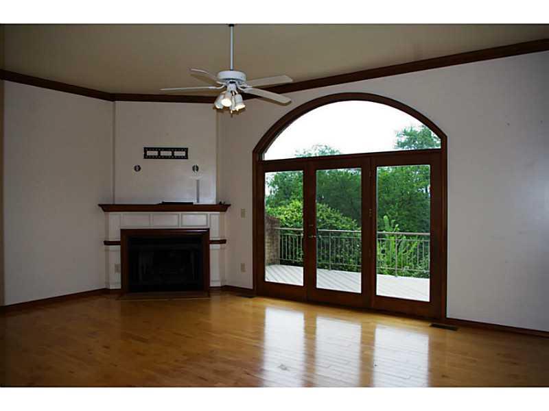 407 Landon Gate Pittsburgh, PA 15215 - Photo 6 of 25 Great Room. Gas burning fireplace, hardwood floors, high ceiling with fan and French doors add drama to the Great Room.