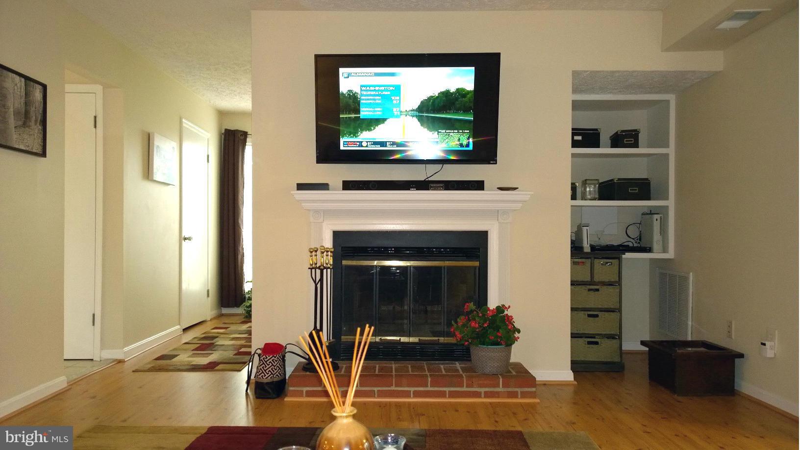 9927 Oakton Terrace Road, Unit 9927 Oakton, VA 22124 - Photo 12 of 19 a living room with furniture and a flat screen tv