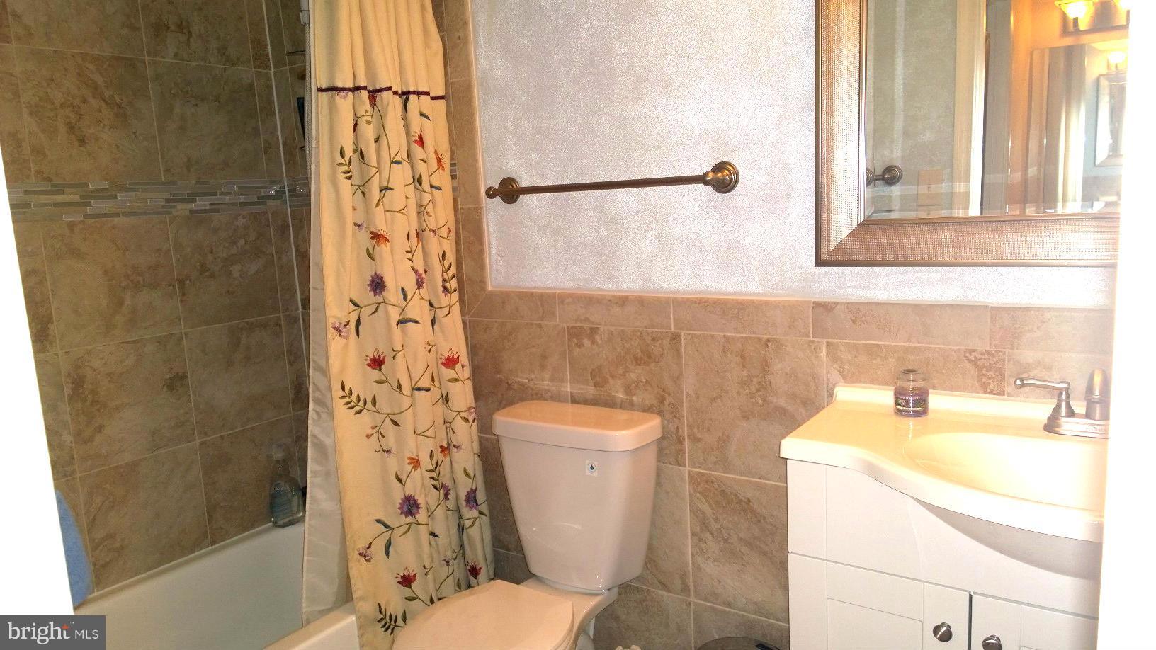 9927 Oakton Terrace Road, Unit 9927 Oakton, VA 22124 - Photo 18 of 19 a bathroom with a sink and a toilet