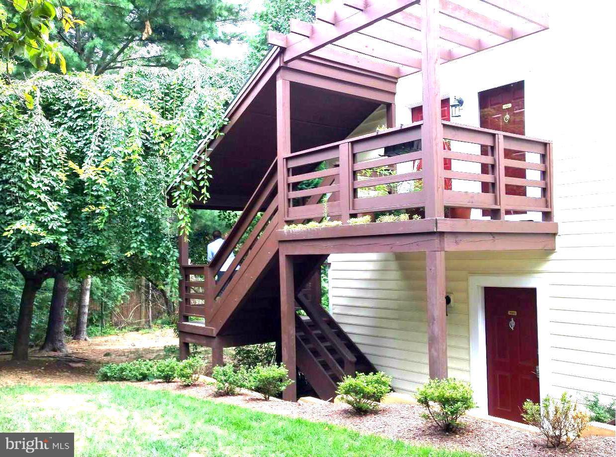9927 Oakton Terrace Road, Unit 9927 Oakton, VA 22124 - Photo 3 of 19 a view of a house with a yard