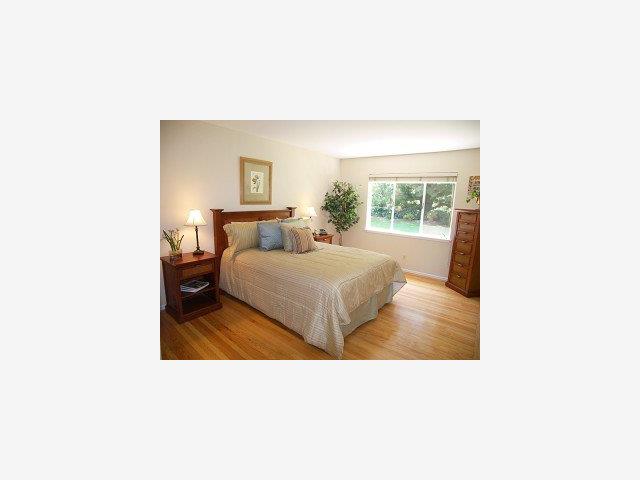1449 Brookmill Road Los Altos, CA 94024 - Photo 6 of 9 a living room with a couch and a window