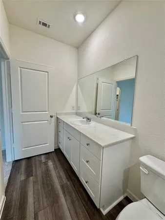 a bathroom with a sink and mirror