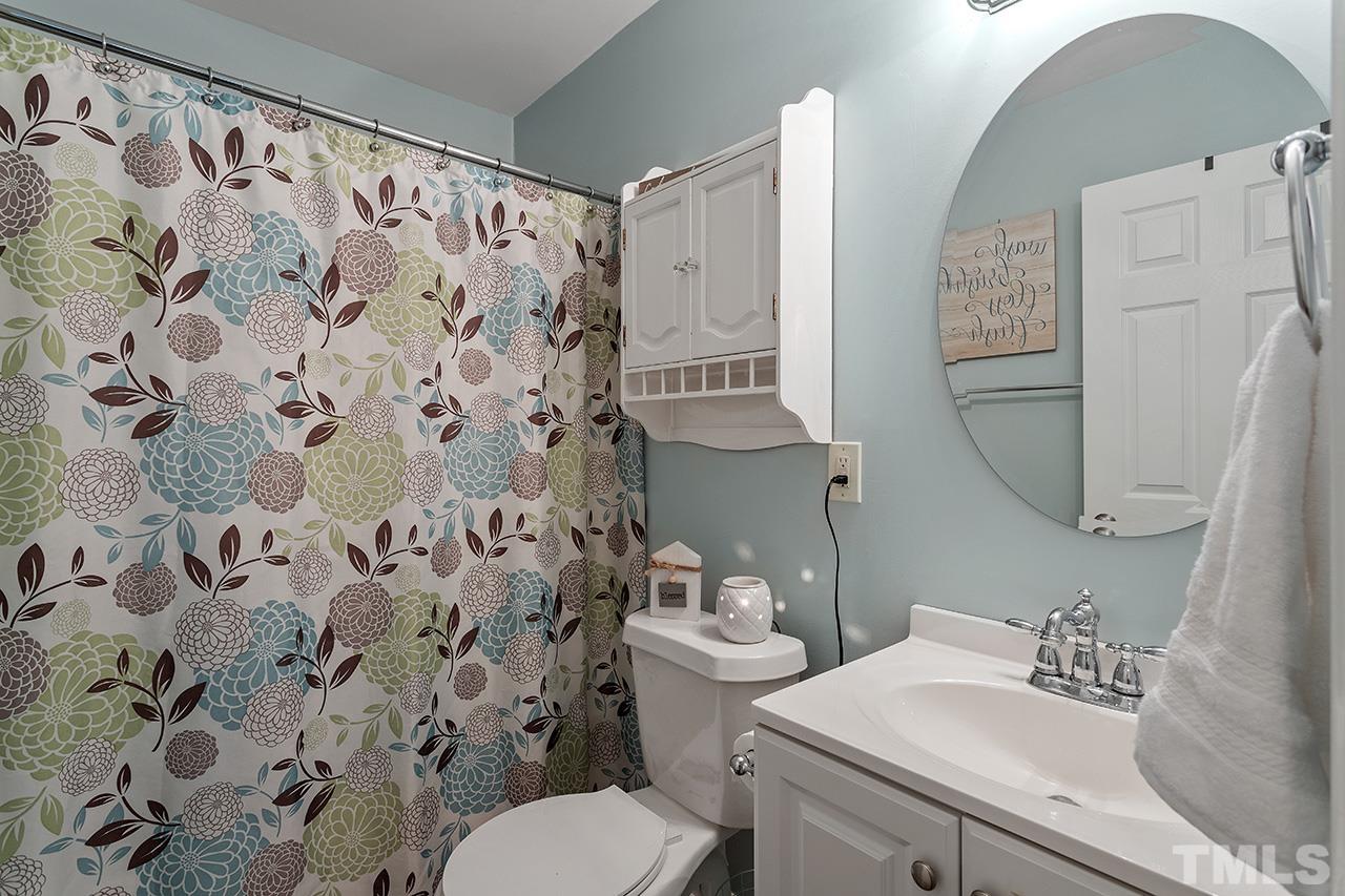 4433 Labrador Drive Raleigh, NC 27616 - Photo 20 of 30 a bathroom with a sink toilet and shower
