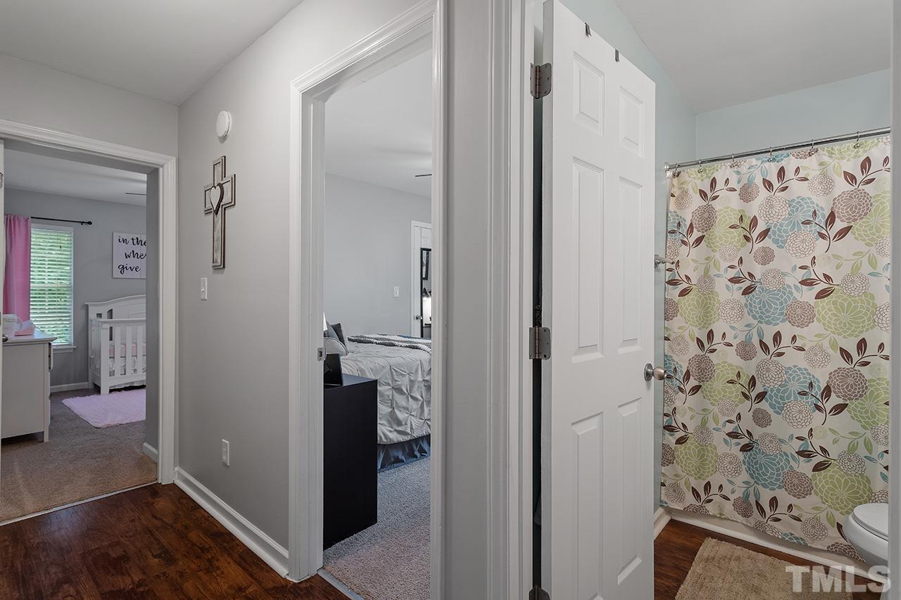 4433 Labrador Drive Raleigh, NC 27616 - Photo 21 of 30 a bathroom with a shower and a sink