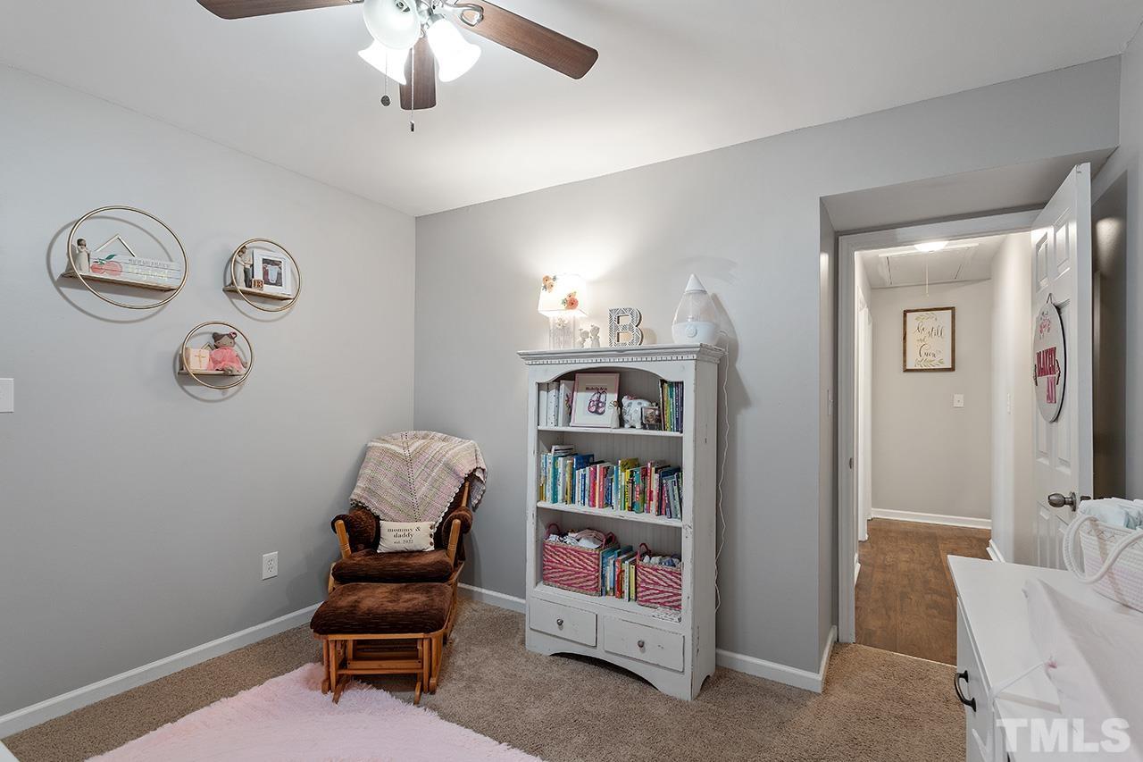 4433 Labrador Drive Raleigh, NC 27616 - Photo 23 of 30 a view of a workspace with furniture and wooden floor
