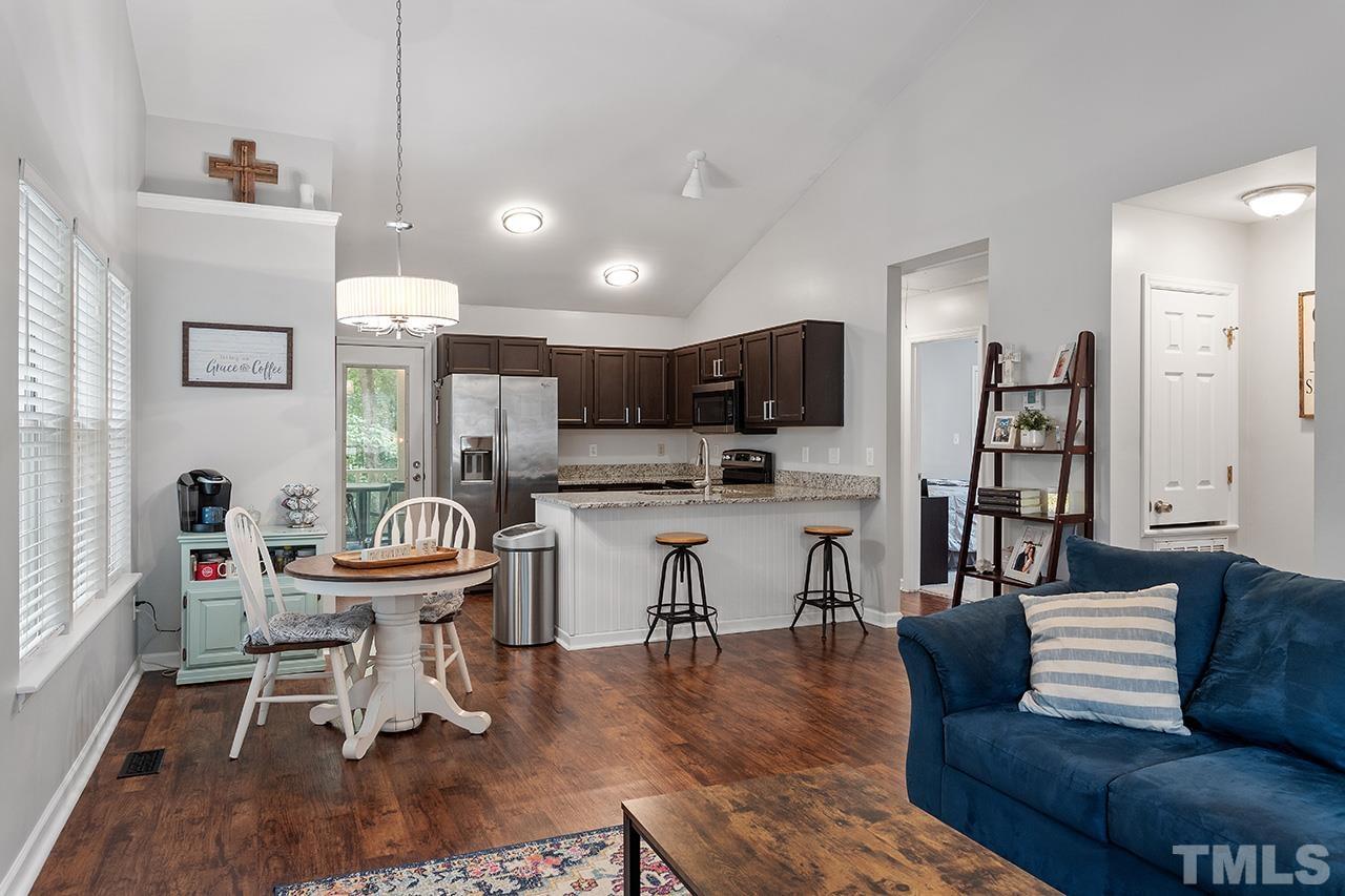 4433 Labrador Drive Raleigh, NC 27616 - Photo 5 of 30 a living room with furniture and kitchen view