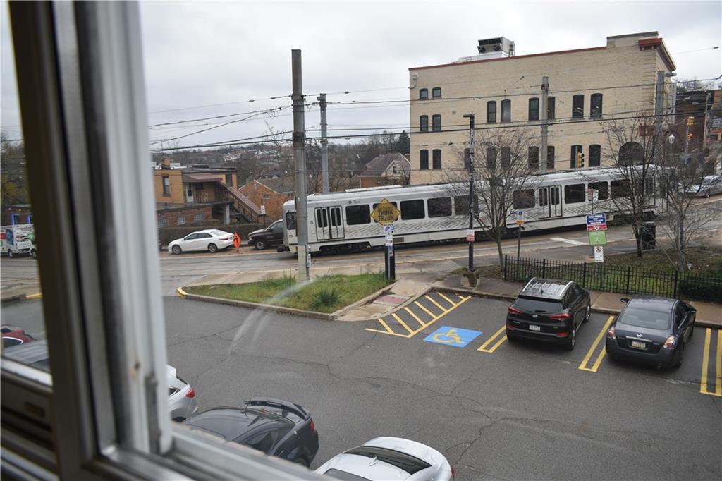 1539 Beechview Avenue Beechview, PA 15216 - Photo 13 of 22 a car parked beside a road next to a building
