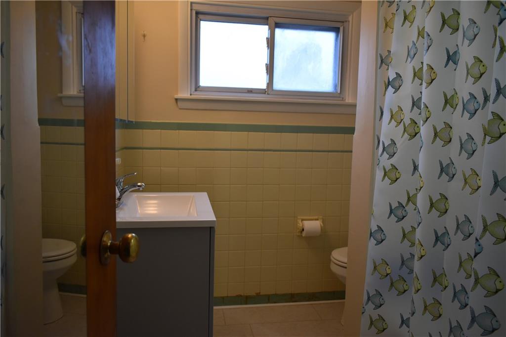1539 Beechview Avenue Beechview, PA 15216 - Photo 7 of 22 a bathroom with a sink toilet and window