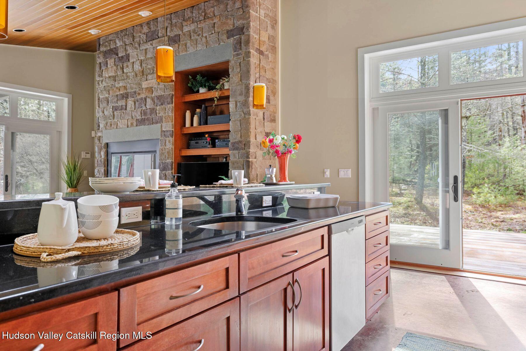41 Shultis Farm Road Bearsville, NY 12409 - Photo 18 of 47 a kitchen with granite countertop a sink and a window