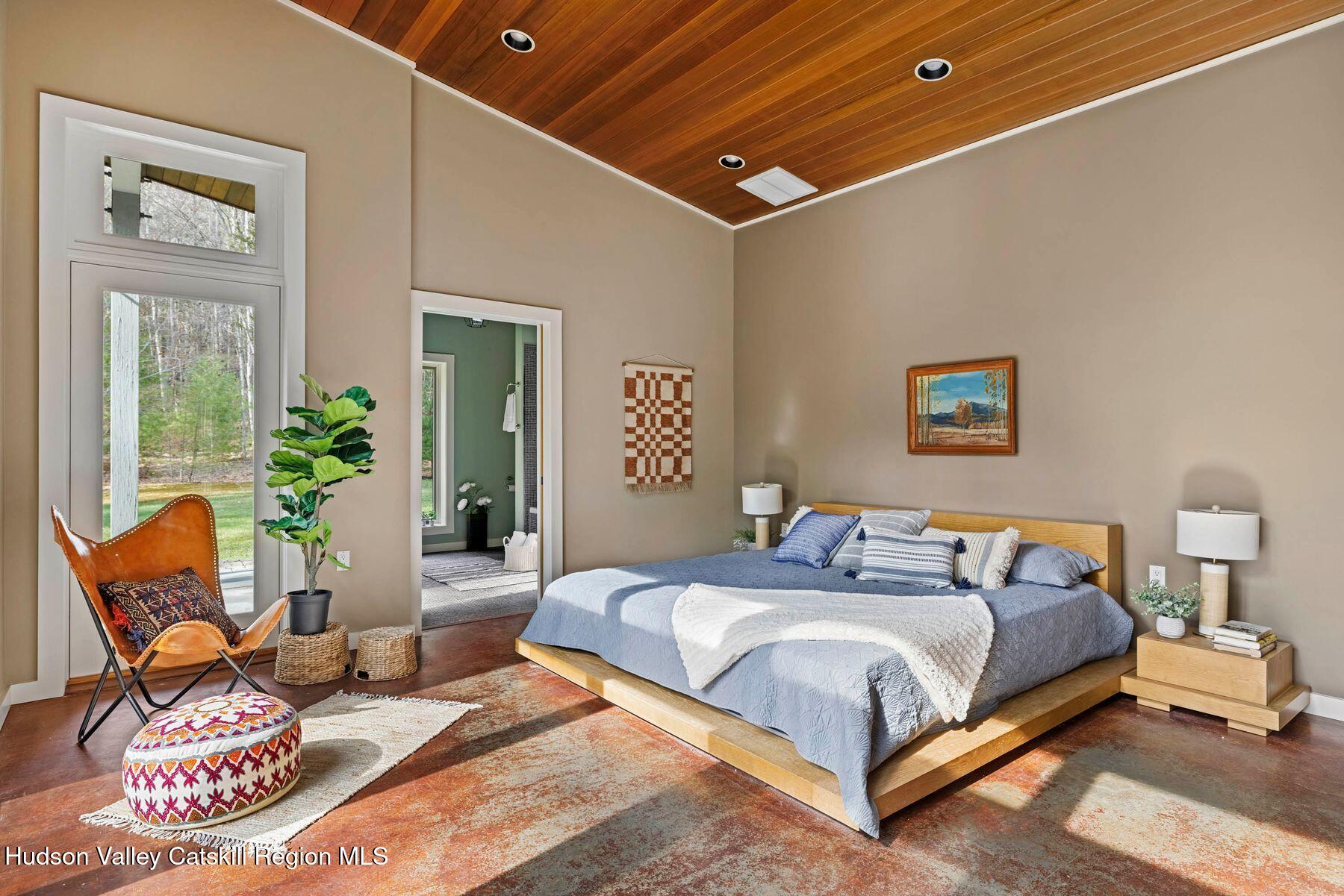 41 Shultis Farm Road Bearsville, NY 12409 - Photo 21 of 47 a bedroom with bed and glass windows