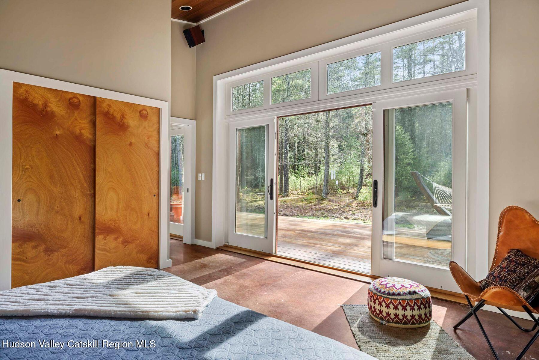 41 Shultis Farm Road Bearsville, NY 12409 - Photo 23 of 47 a bedroom with a bed and a large window with the outer view