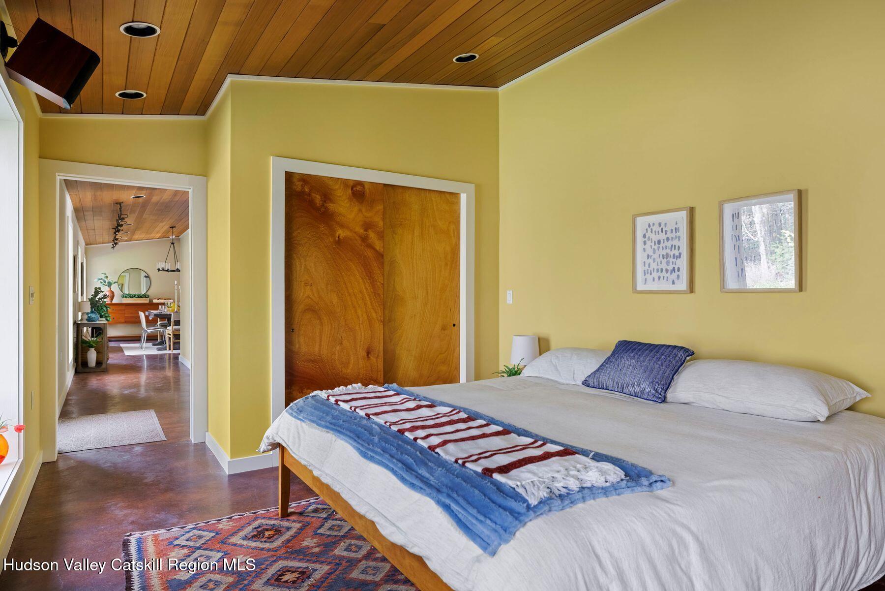 41 Shultis Farm Road Bearsville, NY 12409 - Photo 29 of 47 a bedroom with a bed and a mirror