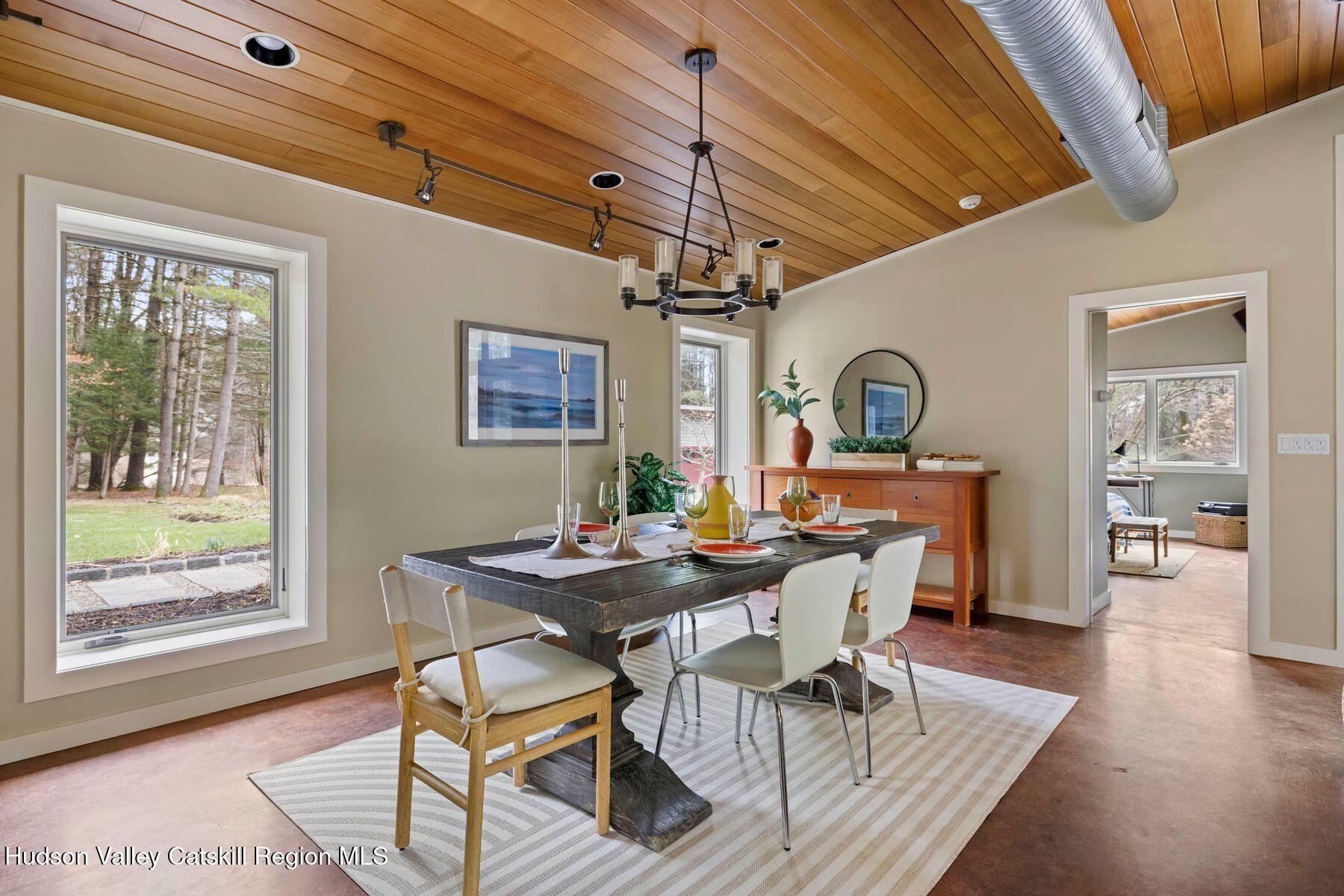 41 Shultis Farm Road Bearsville, NY 12409 - Photo 31 of 47 a view of a dining room with furniture window and wooden floor