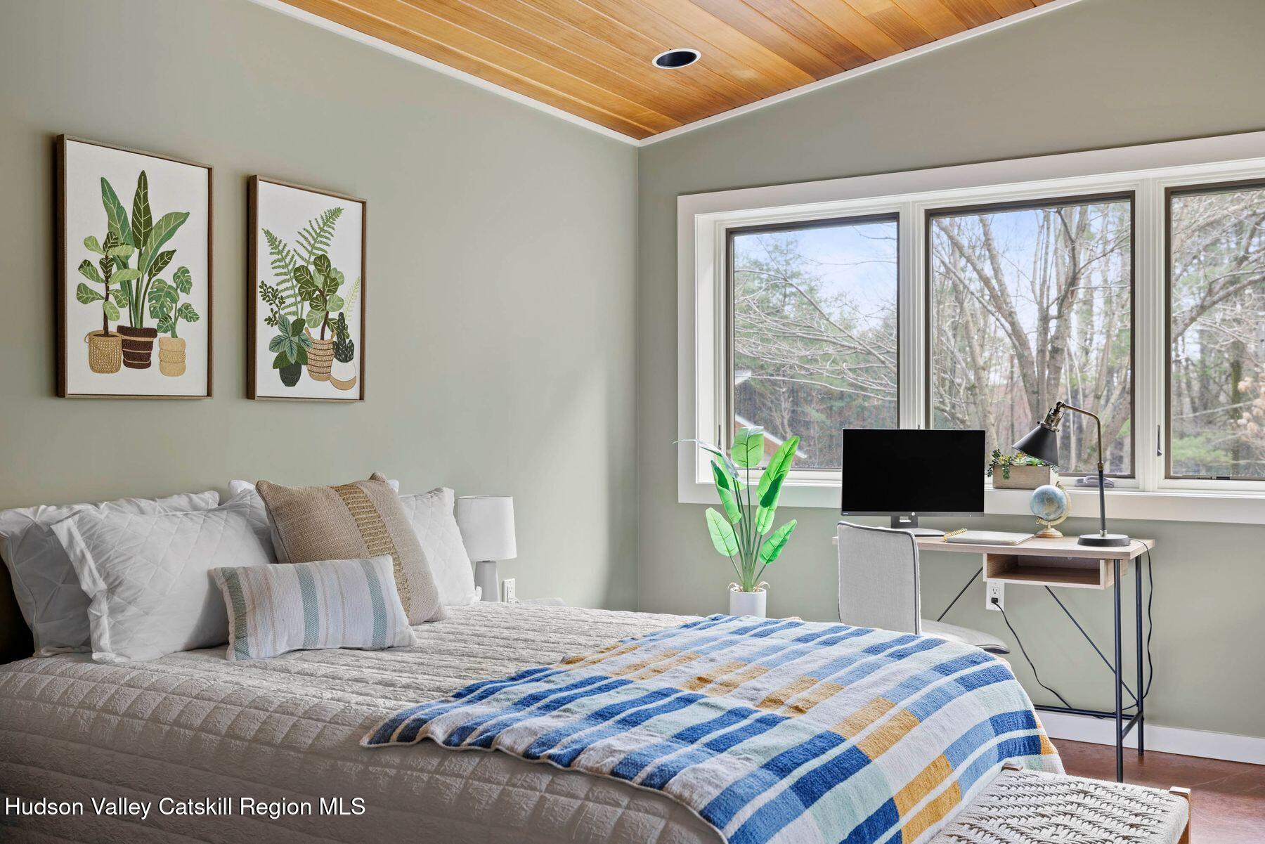 41 Shultis Farm Road Bearsville, NY 12409 - Photo 32 of 47 a bedroom with a bed a computer on the desk and a large window