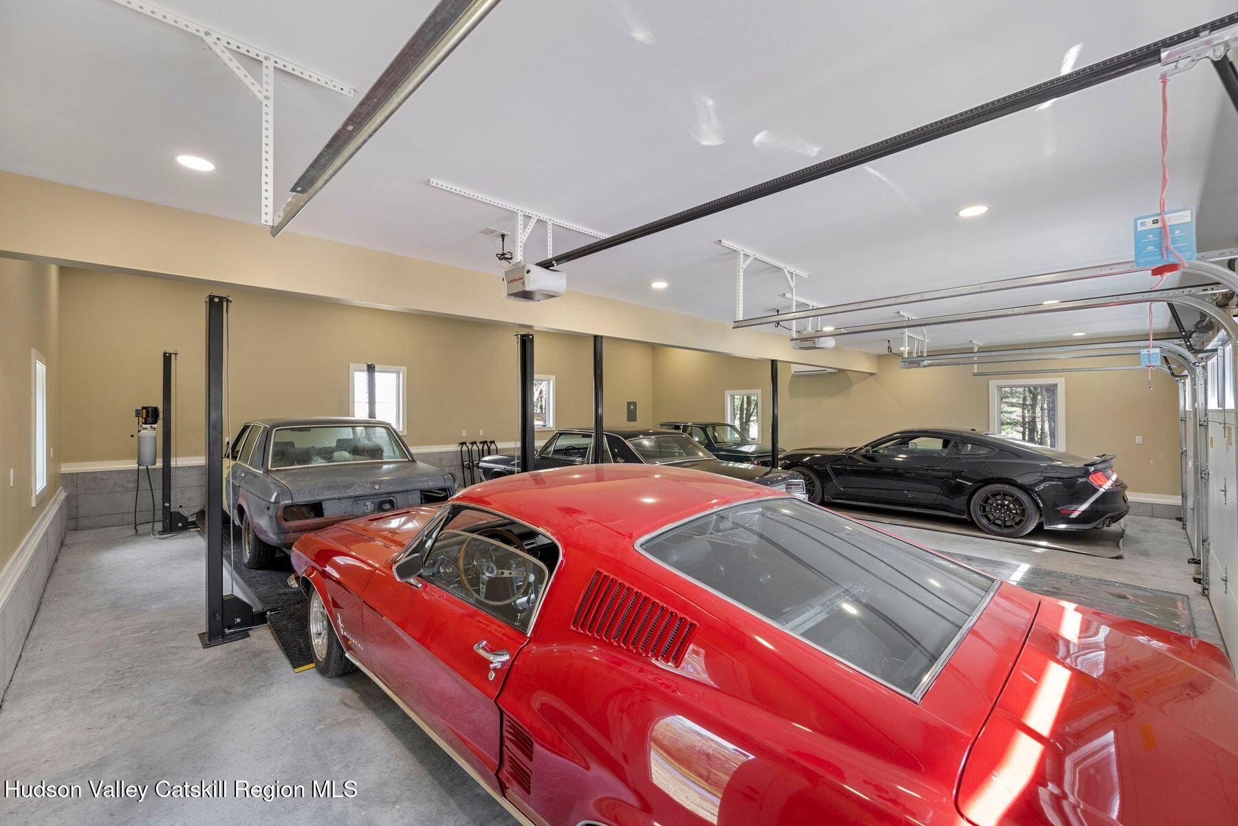 41 Shultis Farm Road Bearsville, NY 12409 - Photo 37 of 47 a living room with furniture a flat screen tv and a large window
