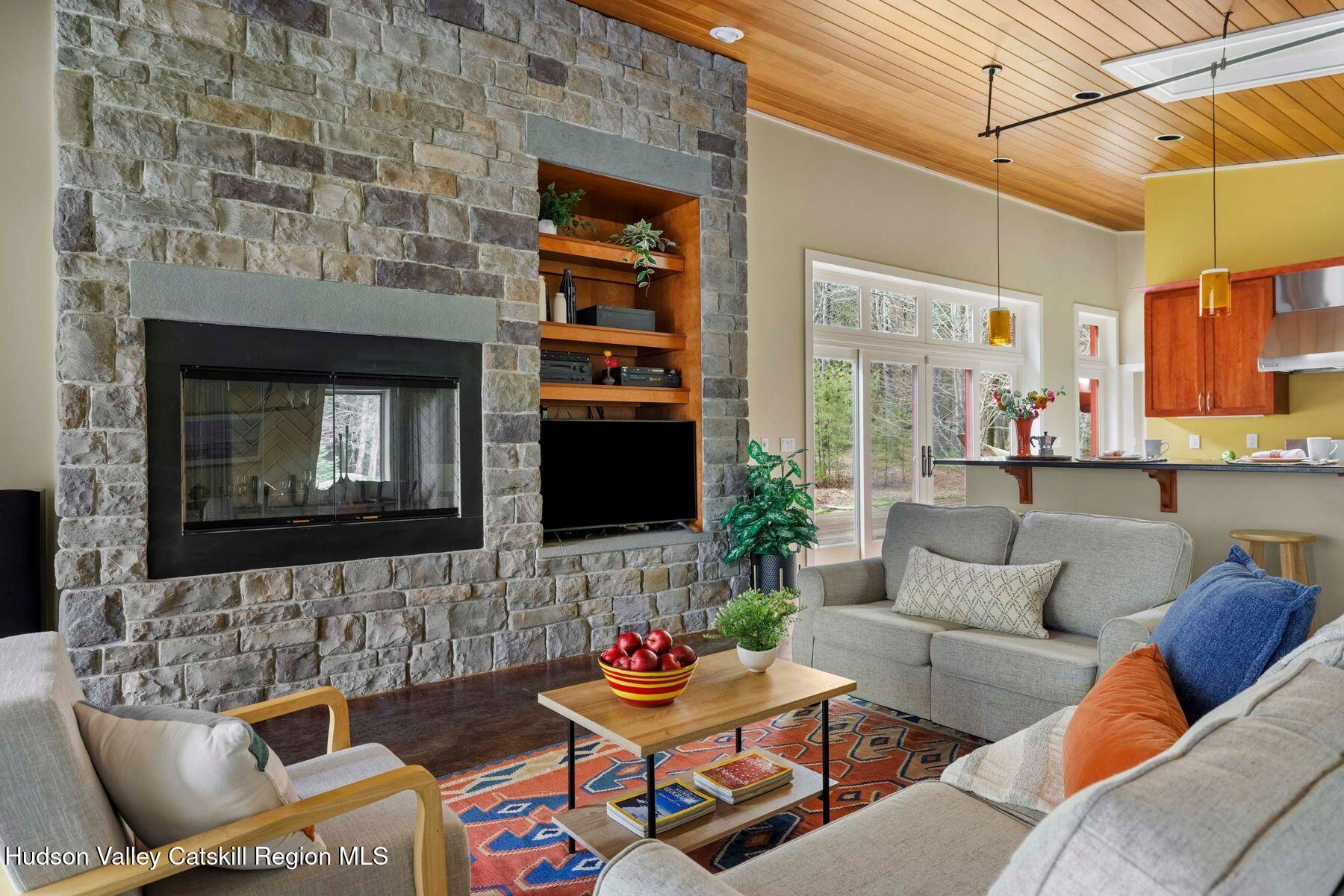 41 Shultis Farm Road Bearsville, NY 12409 - Photo 6 of 47 a living room with furniture and a fireplace