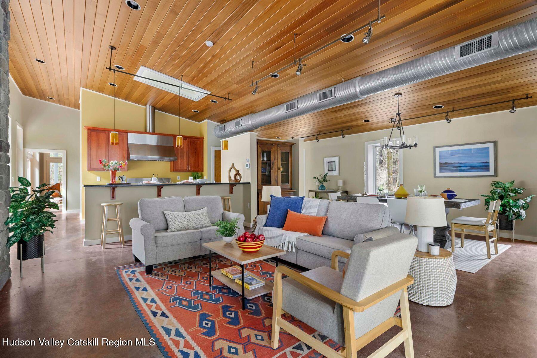 41 Shultis Farm Road Bearsville, NY 12409 - Photo 7 of 47 a living room with furniture and a chandelier
