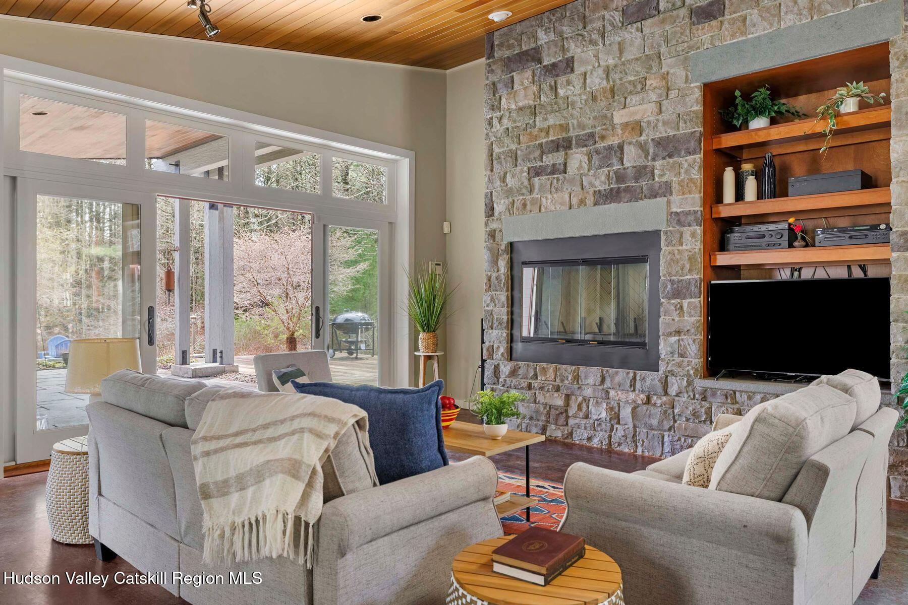 41 Shultis Farm Road Bearsville, NY 12409 - Photo 8 of 47 a living room with furniture fireplace and a flat screen tv