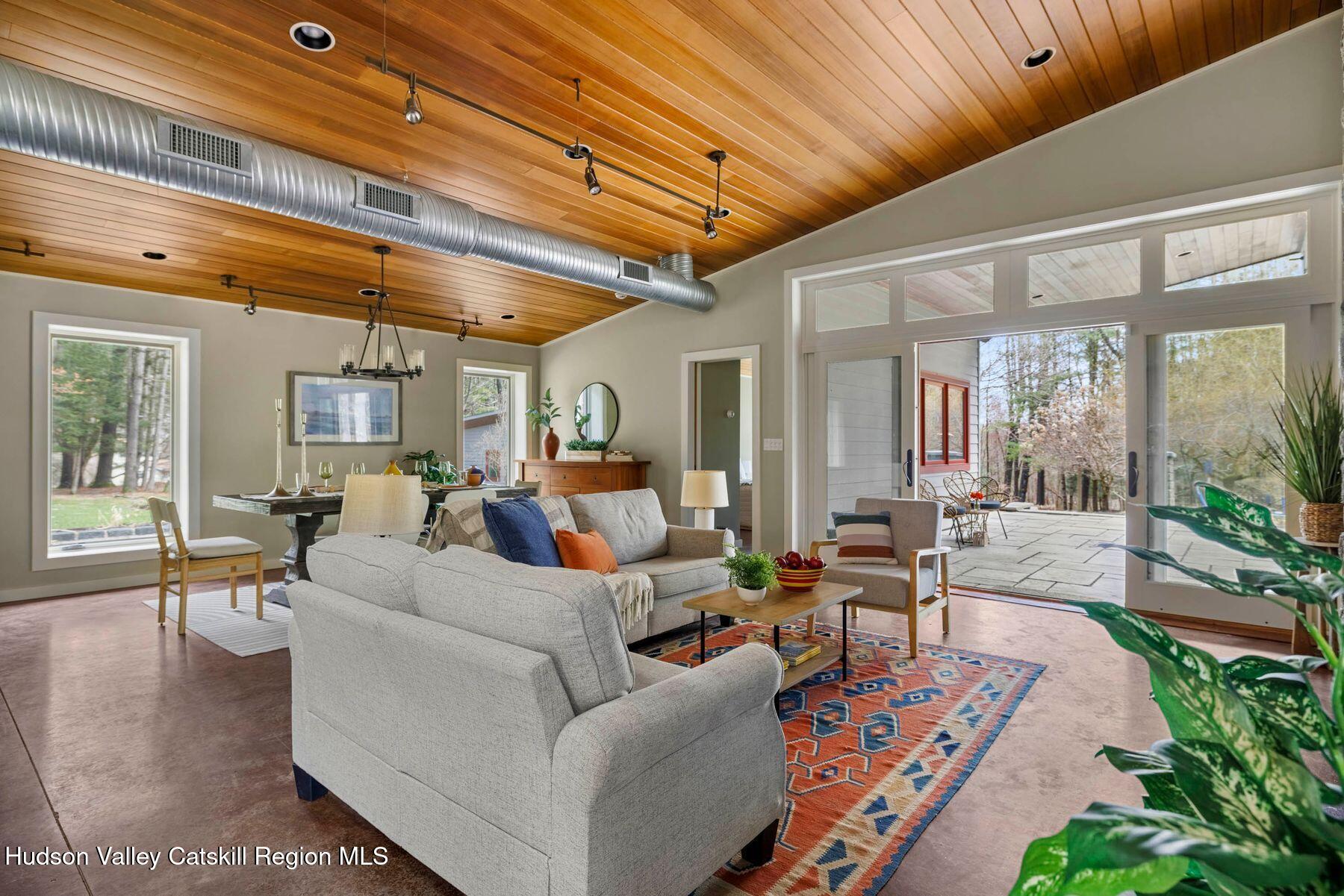 41 Shultis Farm Road Bearsville, NY 12409 - Photo 9 of 47 a living room with furniture and a large window