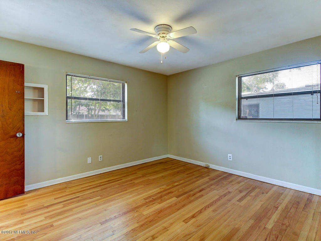 3755 Rogero Road Jacksonville, FL 32277 - Photo 17 of 32 a view of room with window and ceiling fan