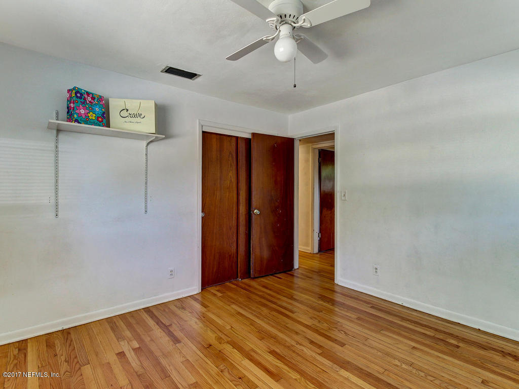 3755 Rogero Road Jacksonville, FL 32277 - Photo 20 of 32 wooden floor in an empty room