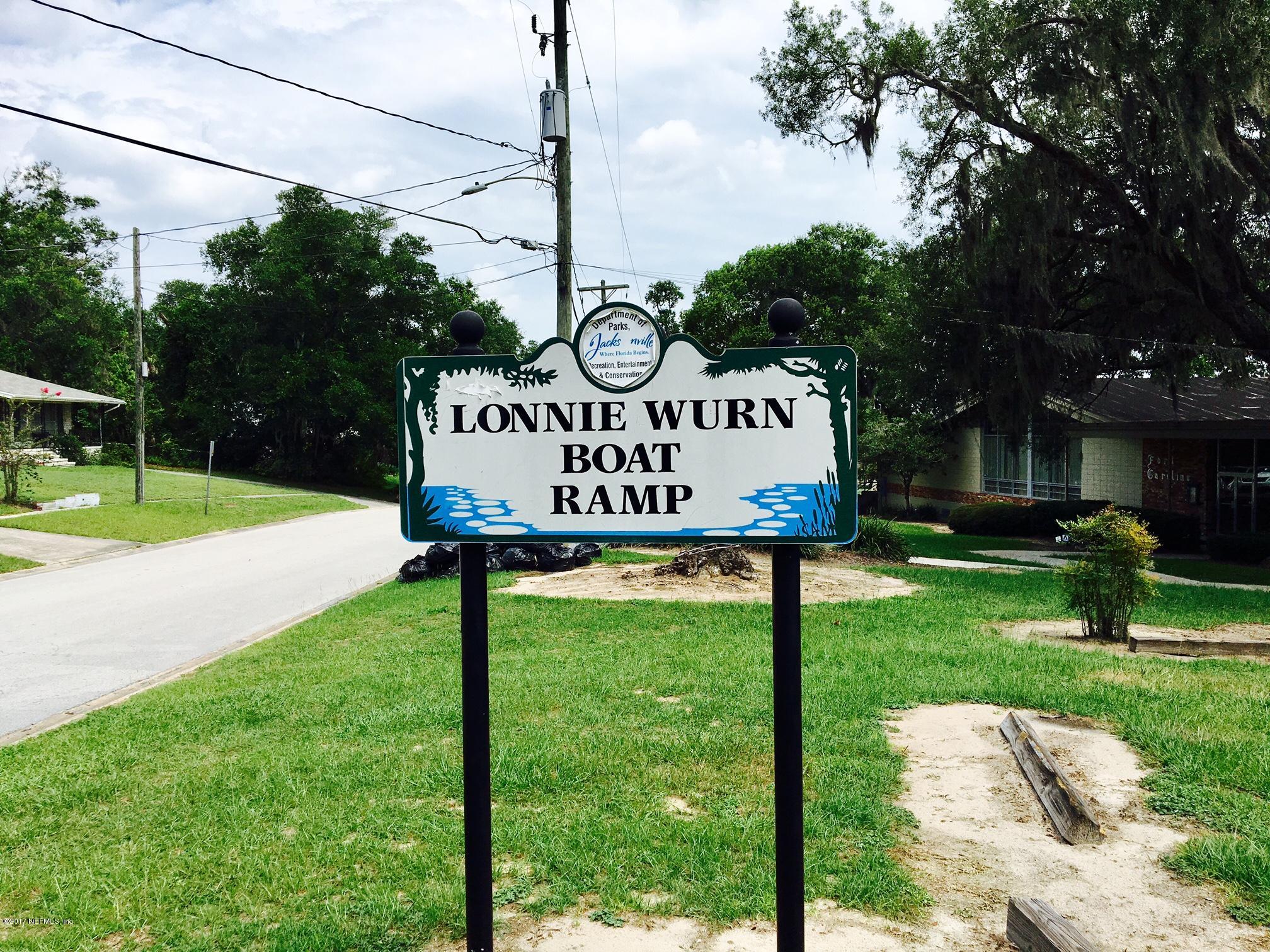 3755 Rogero Road Jacksonville, FL 32277 - Photo 28 of 32 a view of a street with sign board
