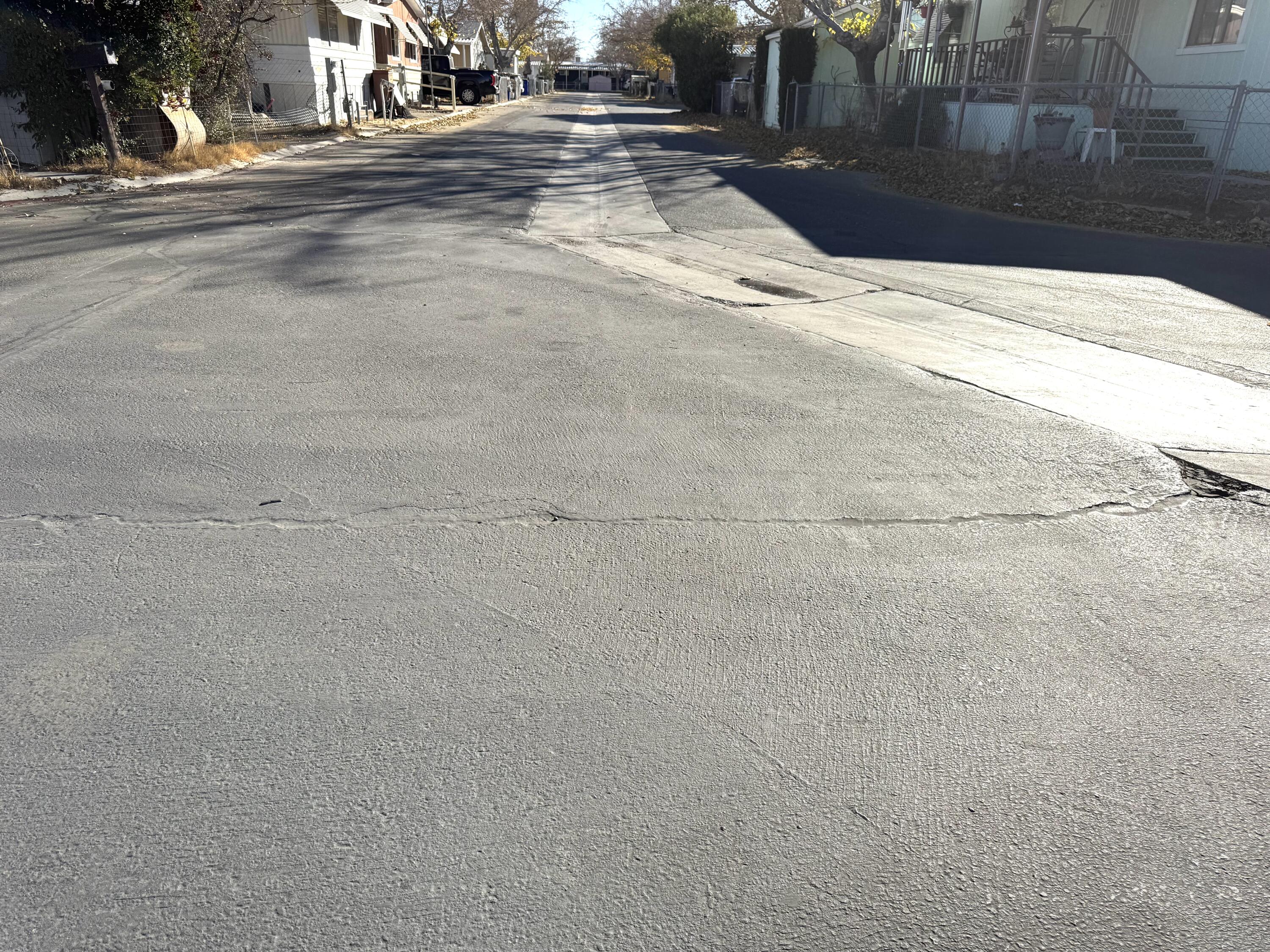 45800 Challanger Way Lancaster, CA 93535 - Photo 14 of 16 a view of road with yard