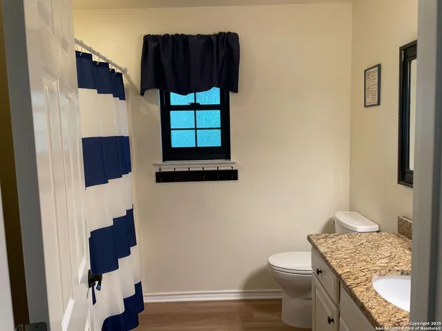a bathroom with a toilet and a sink