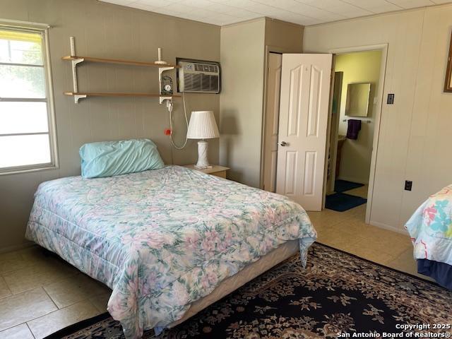 400 North Chaparral Burnet, TX 78611 - Photo 18 of 24 a bedroom with a bed and wooden floor