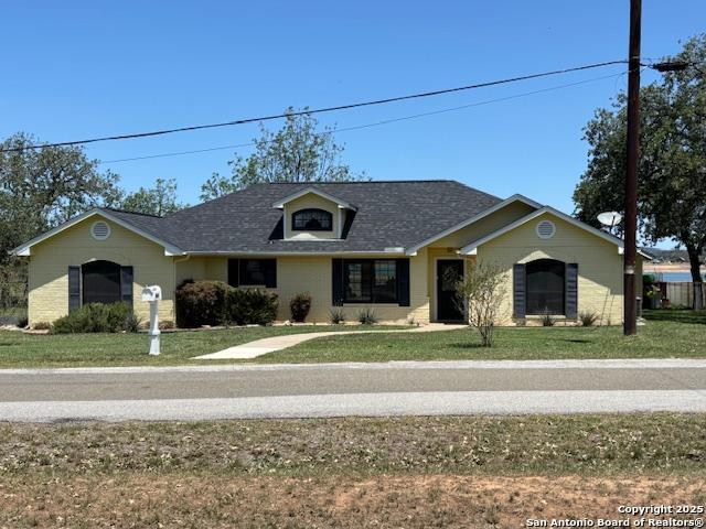 400 North Chaparral Burnet, TX 78611 - Photo 4 of 24 a front view of a house with a yard